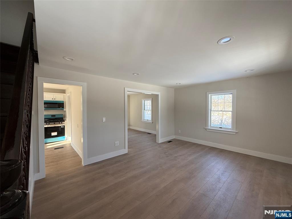 13 Mountainside Avenue Mahwah, NJ 07430 - Photo 9 of 11 an empty room with wooden floor and windows