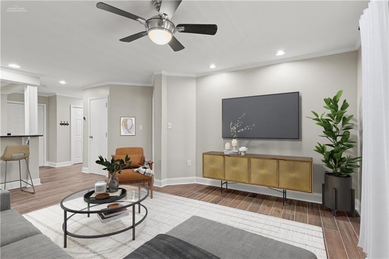 3655 Habersham Road Northeast, Unit A108 Atlanta, GA 30305 - Photo 3 of 30 a living room with furniture and a flat screen tv