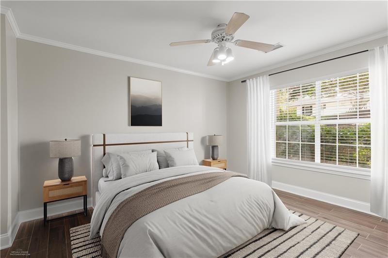 3655 Habersham Road Northeast, Unit A108 Atlanta, GA 30305 - Photo 10 of 30 a bedroom with a large bed and a window