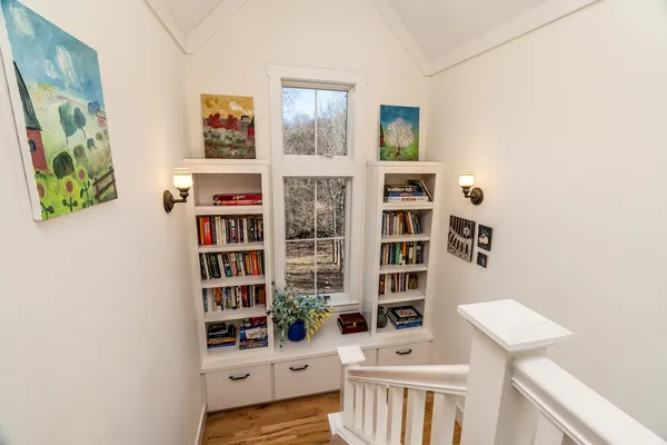 a view of a room with window and wooden floor
