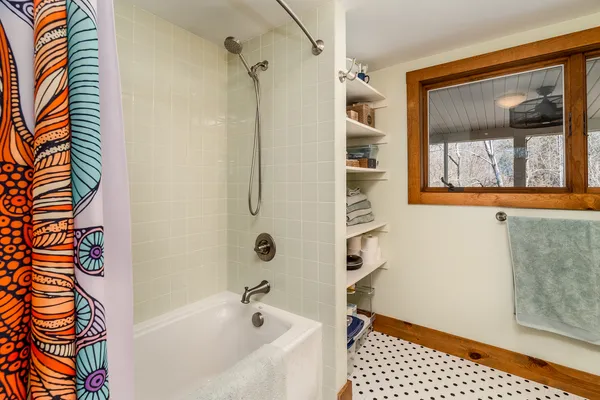 a kitchen with stainless steel appliances granite countertop a refrigerator and wooden floor