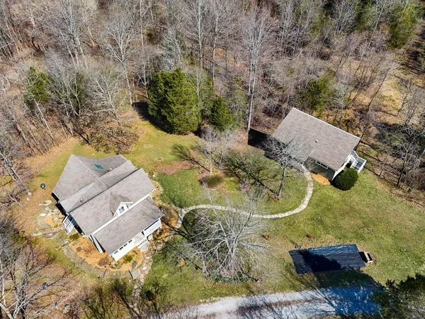 an aerial view of a house with swimming pool