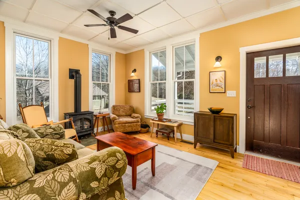a living room with furniture and a table