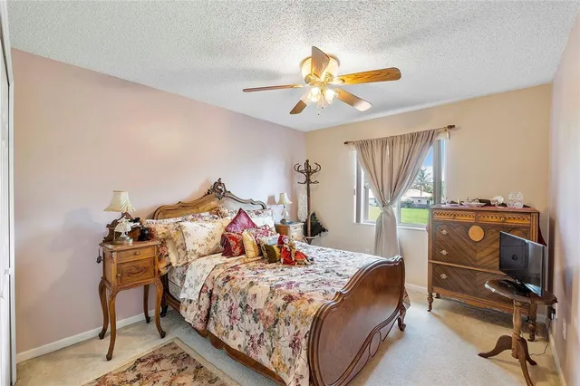 a bed room with a bed and a chandelier