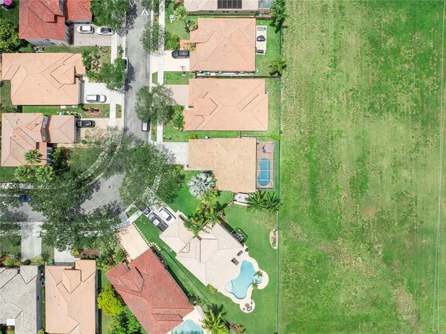 an aerial view of a house with garden