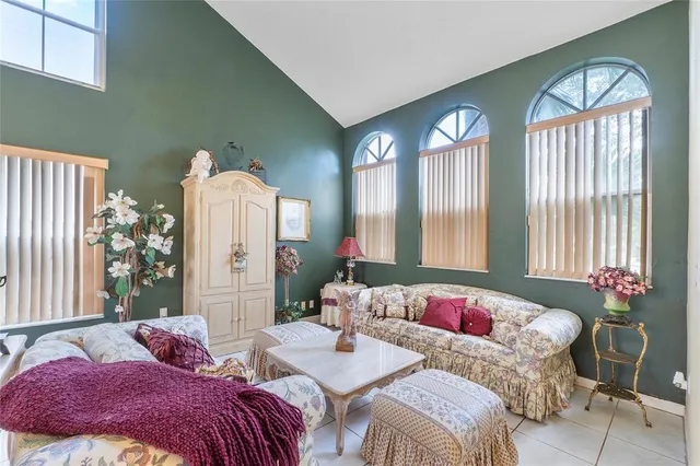 a bedroom with two beds and a large window