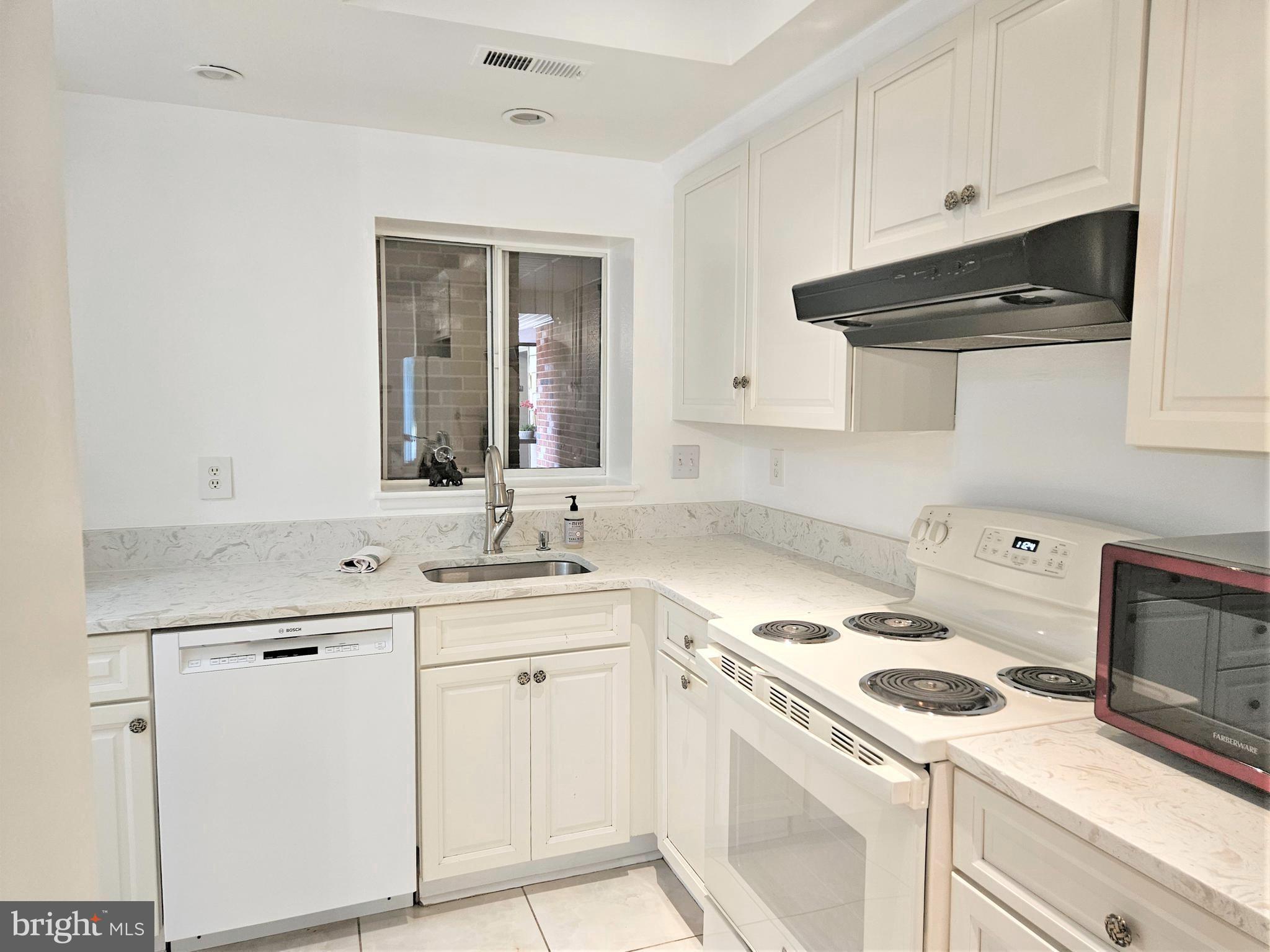 3501 Forest Edge Drive, Unit 141E Silver Spring, MD 20906 - Photo 2 of 27 Beautifully Updated White Kitchen