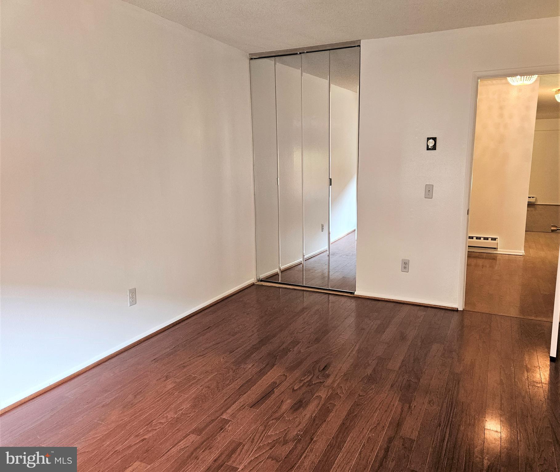 3501 Forest Edge Drive, Unit 141E Silver Spring, MD 20906 - Photo 21 of 27 Mirrored Closet Doors of Second Bedroom