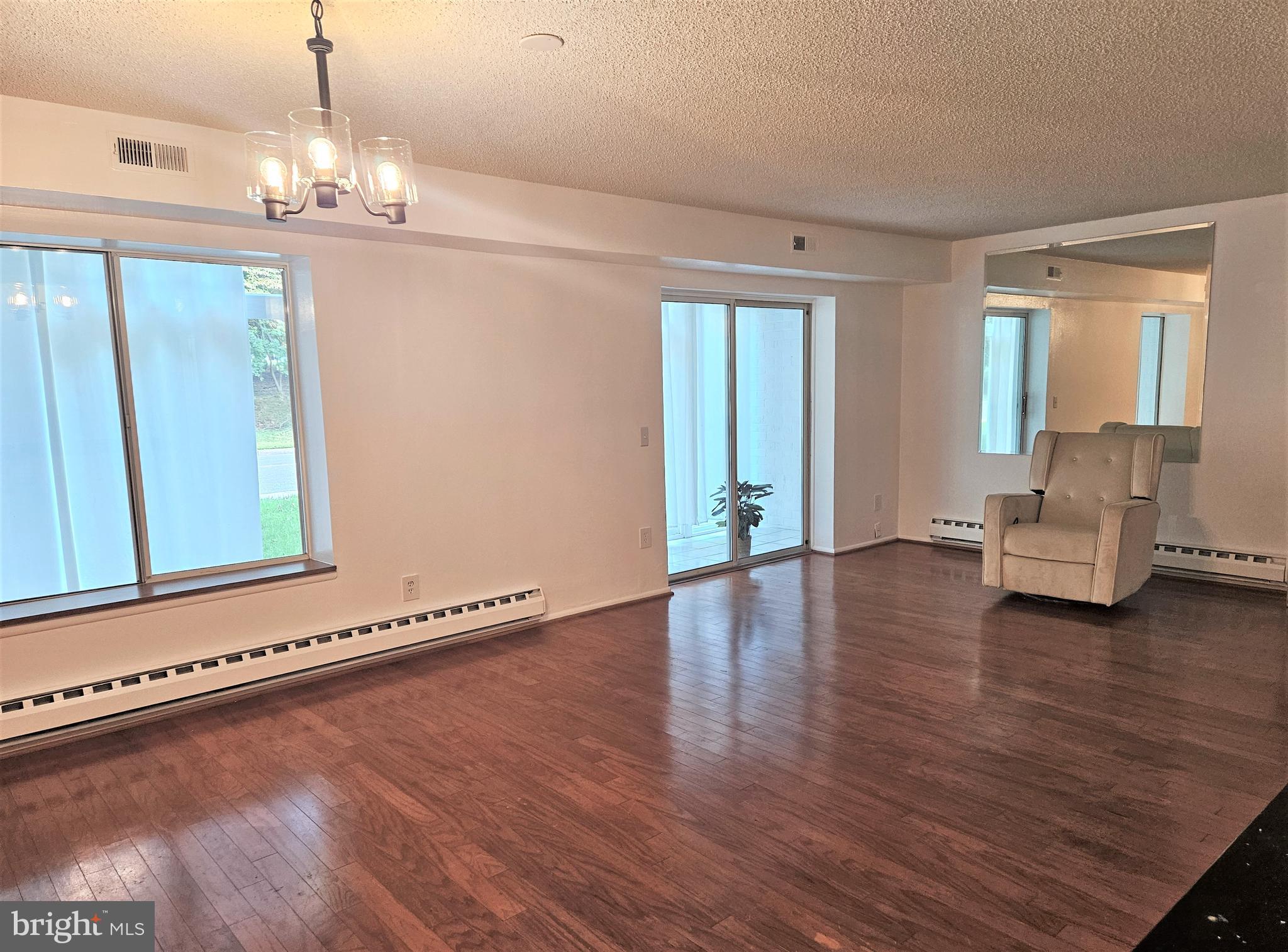 3501 Forest Edge Drive, Unit 141E Silver Spring, MD 20906 - Photo 4 of 27 Spacious Living Room/sliding glass doors to Patio
