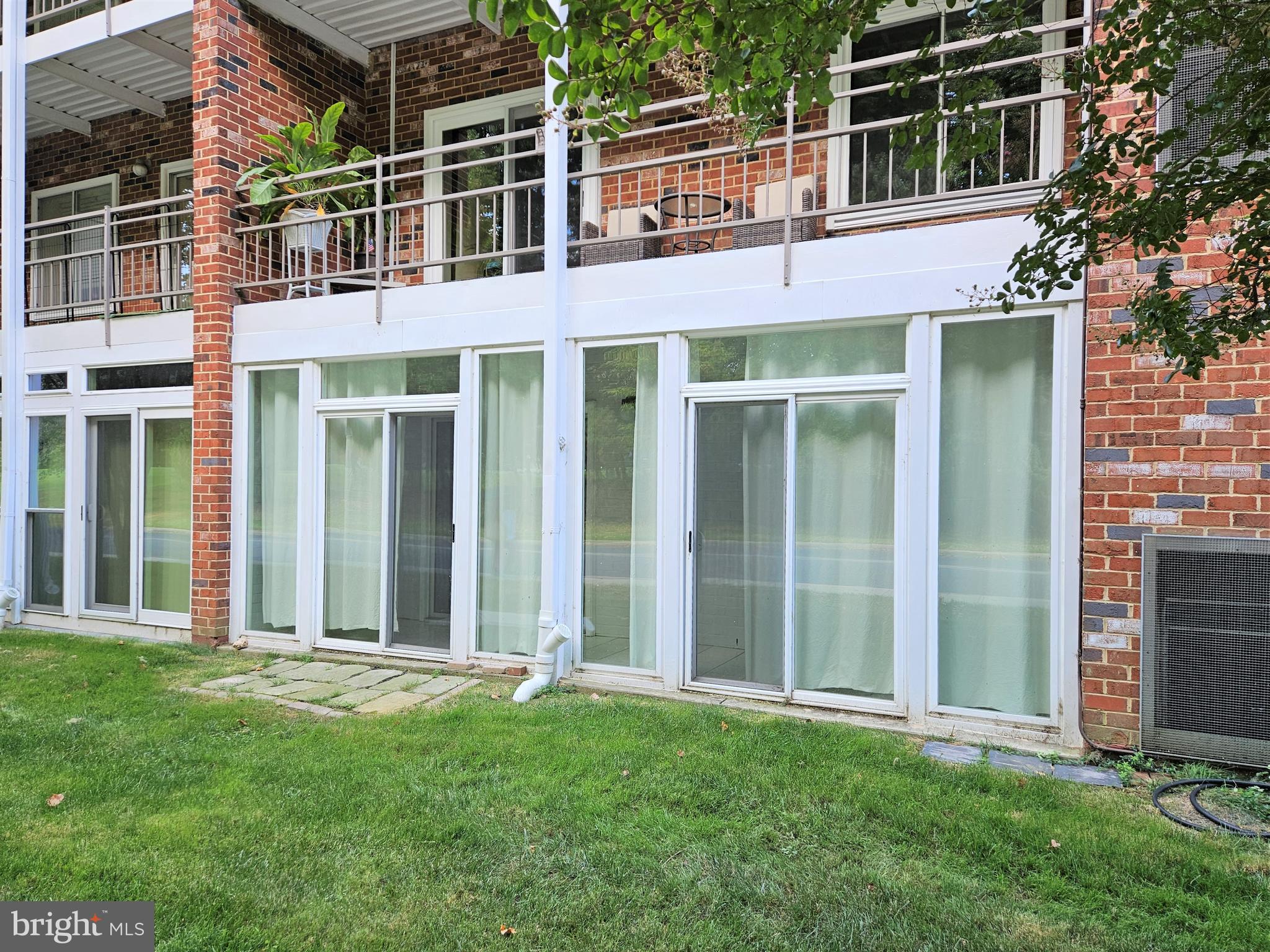 3501 Forest Edge Drive, Unit 141E Silver Spring, MD 20906 - Photo 6 of 27 Exterior Glass Enclosed Patio