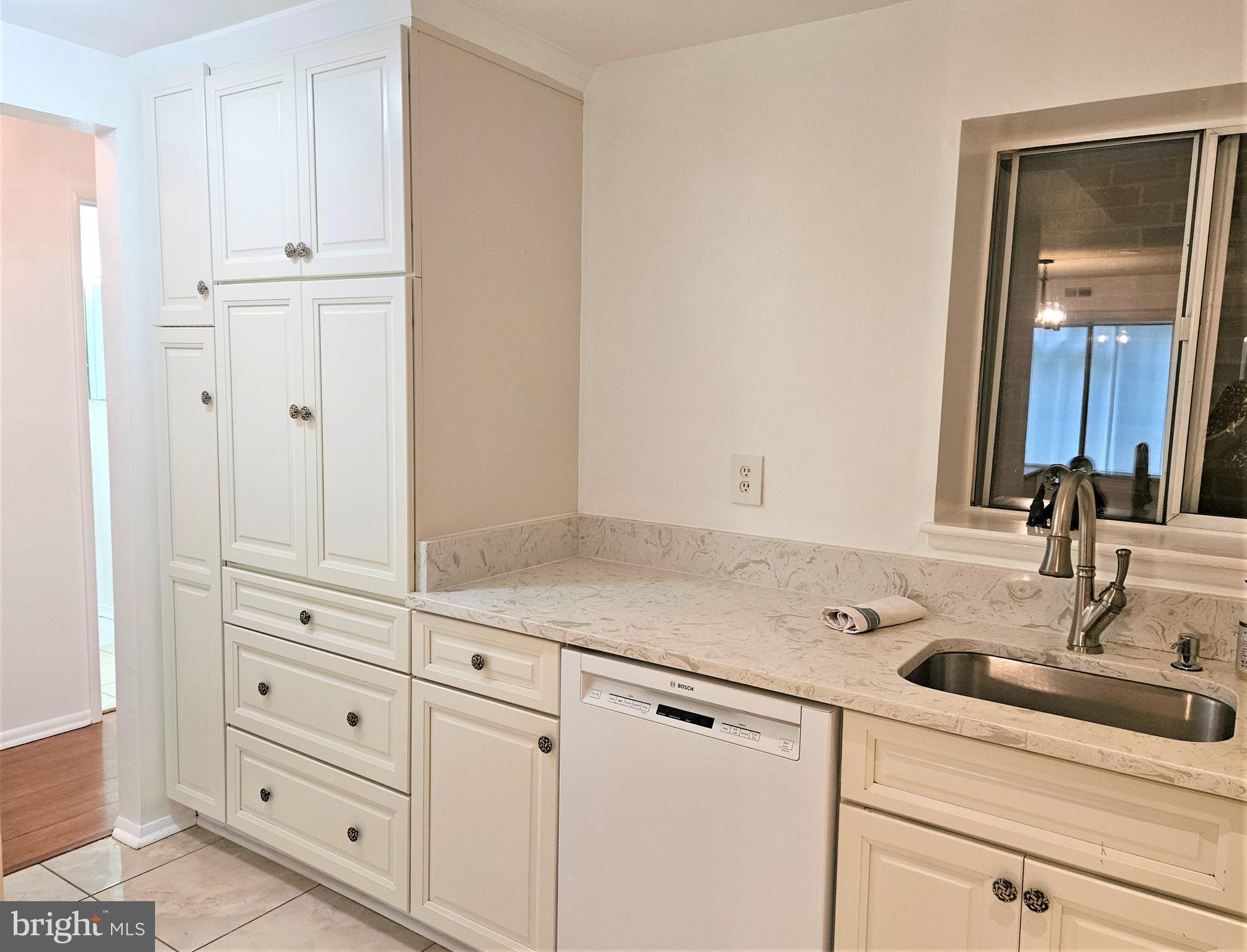 3501 Forest Edge Drive, Unit 141E Silver Spring, MD 20906 - Photo 8 of 27 Added Storage Closet and Counter Space