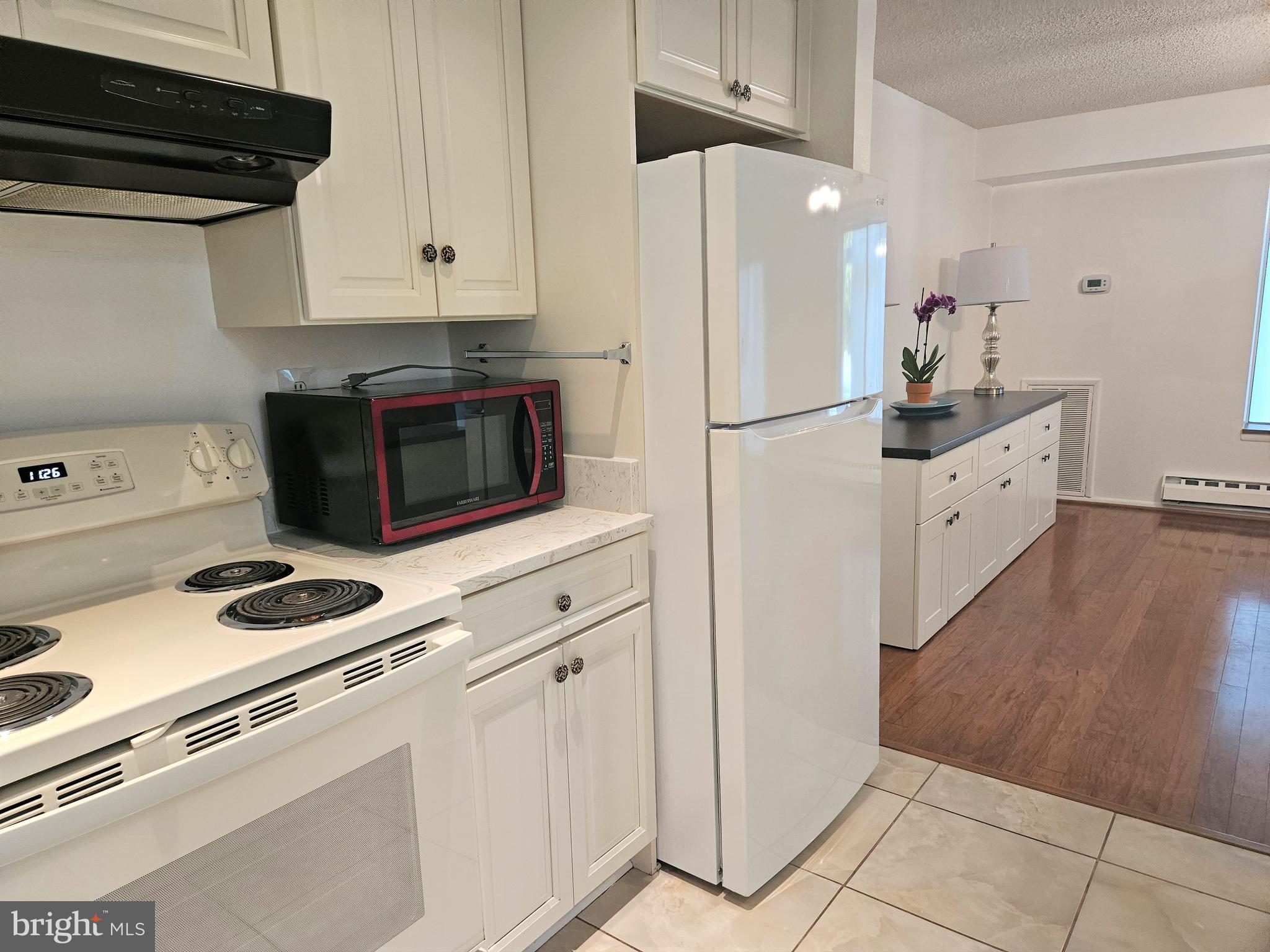 3501 Forest Edge Drive, Unit 141E Silver Spring, MD 20906 - Photo 10 of 27 Flow between Kitchen and Dining Room