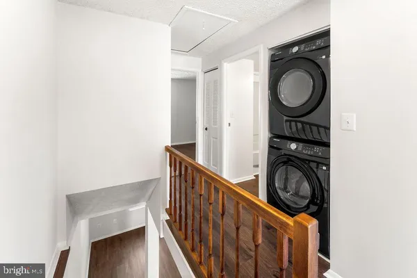 a view of a hallway with washer and dryer