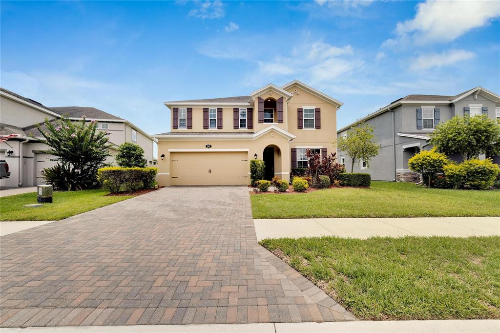 a front view of a house with a yard