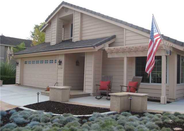 Lovely front porch will make all of your guests feel welcomed the moment they arrive! Also, be sure to take note of the extra wide driveway and additional storage on the side of the home!