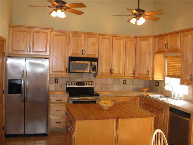 Fabulous kitchen with high end MAPLE CABINETS, under cabinet lighting, soffit lighting (dramatic effect at night!), TWO islands with butcher block tops (also custom!), FULL Suite of Stainless Appliances, INCLUDING the FRIDGE, Oversized Pantry.