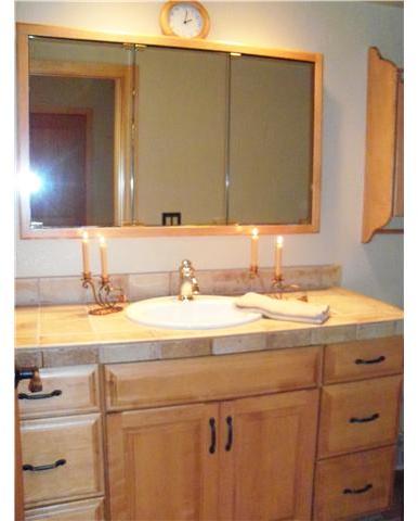 534 Gardendale Road Encinitas, CA 92024 - Photo 10 of 25 Highly upgraded powder room with CUSTOM MAPLE CABINETS, new plumbing fixtures, newer lighting & neutral paint tones.