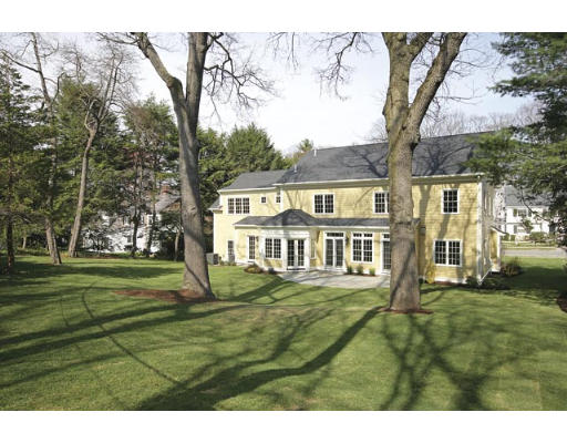 53 Valley Road Brookline, MA 02467 - Photo 5 of 5 a front view of a house with a garden