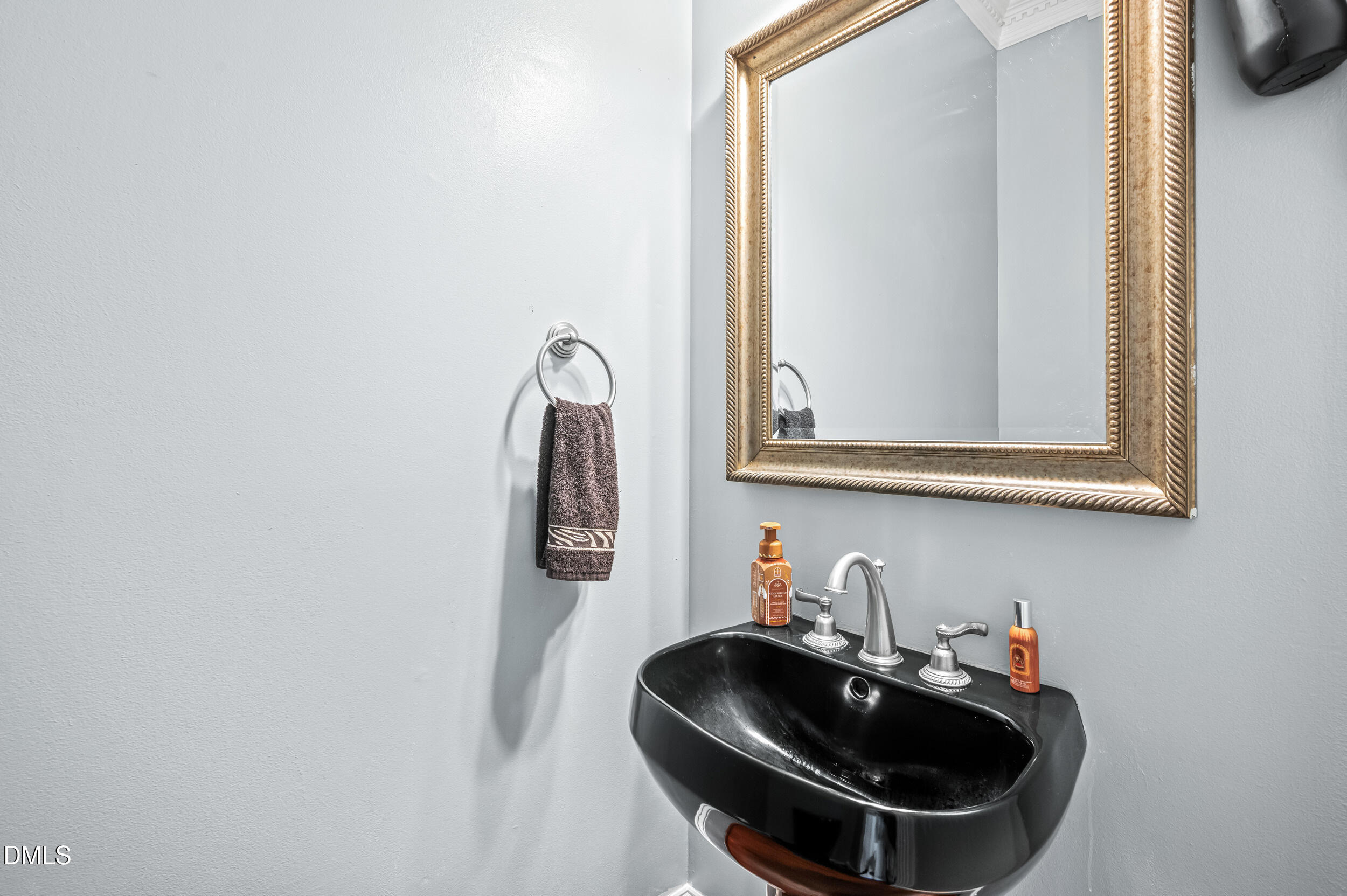 1957 Hilltop Road Raleigh, NC 27610 - Photo 8 of 46 a bathroom with a sink and a mirror