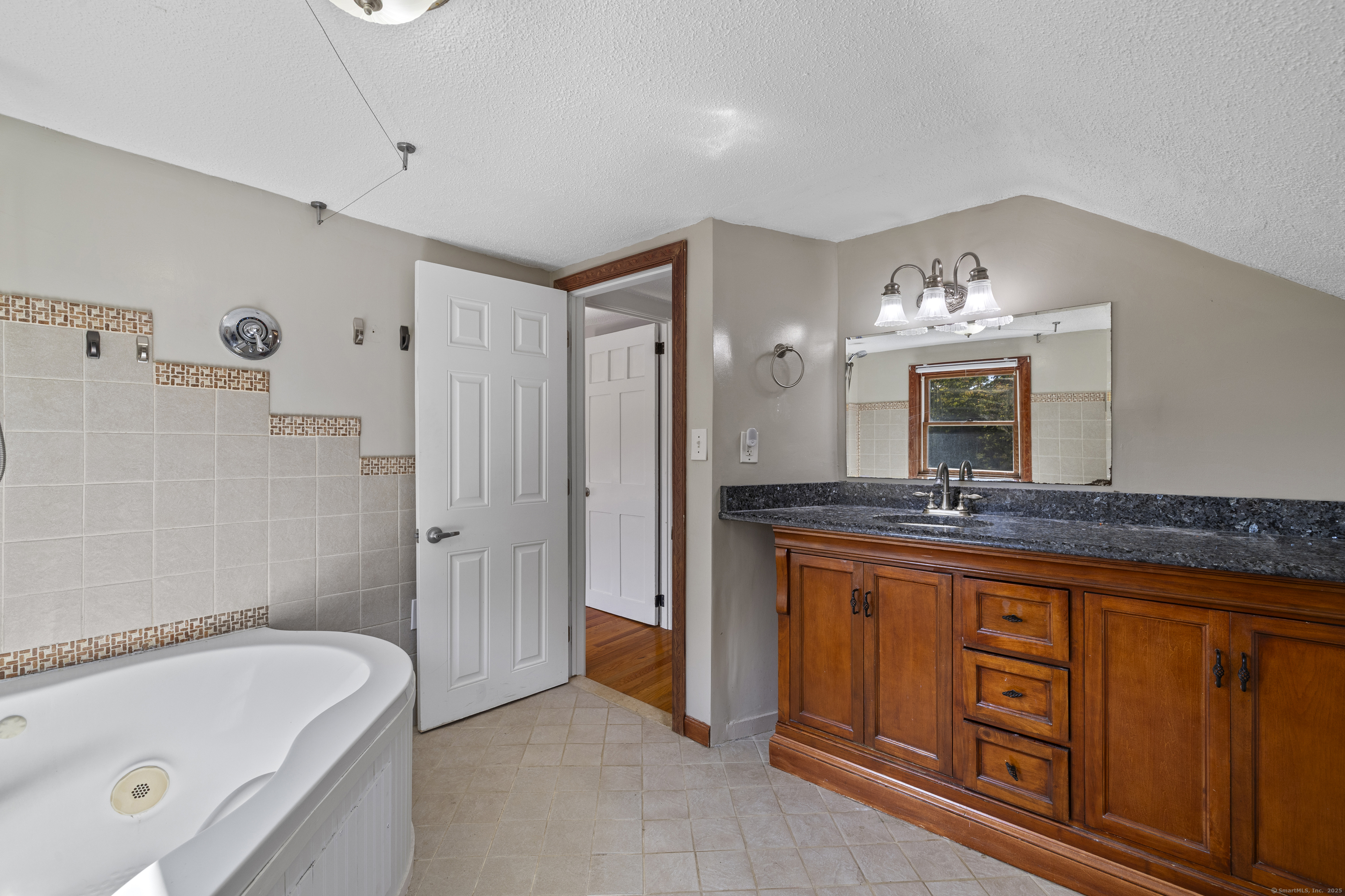 270 Gay Hill Road Montville, CT 06382 - Photo 23 of 35 a bathroom with a tub a sink and a mirror