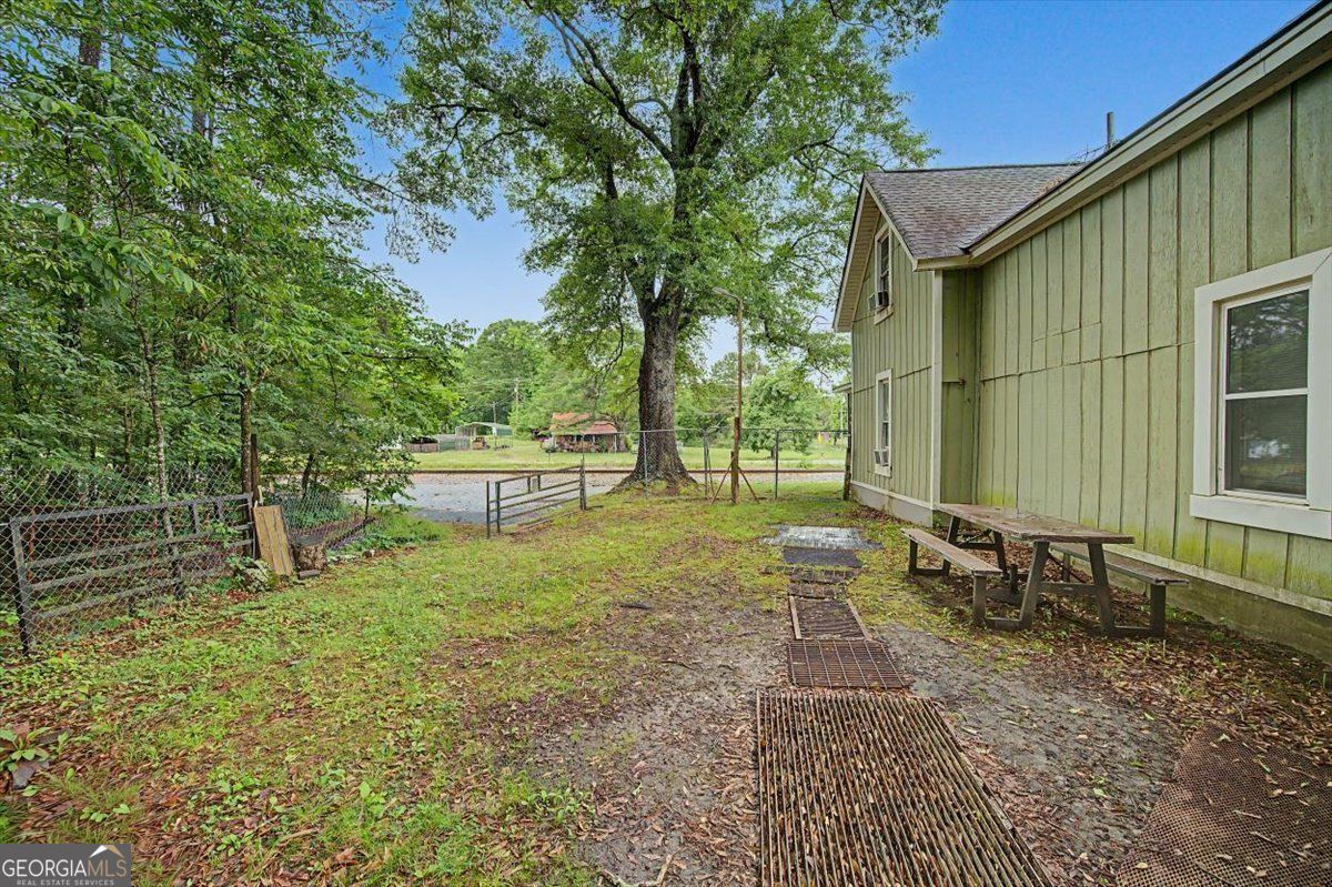 483 Coal Road Northwest Resaca, GA 30735 - Photo 39 of 56 a backyard of a house with outdoor seating