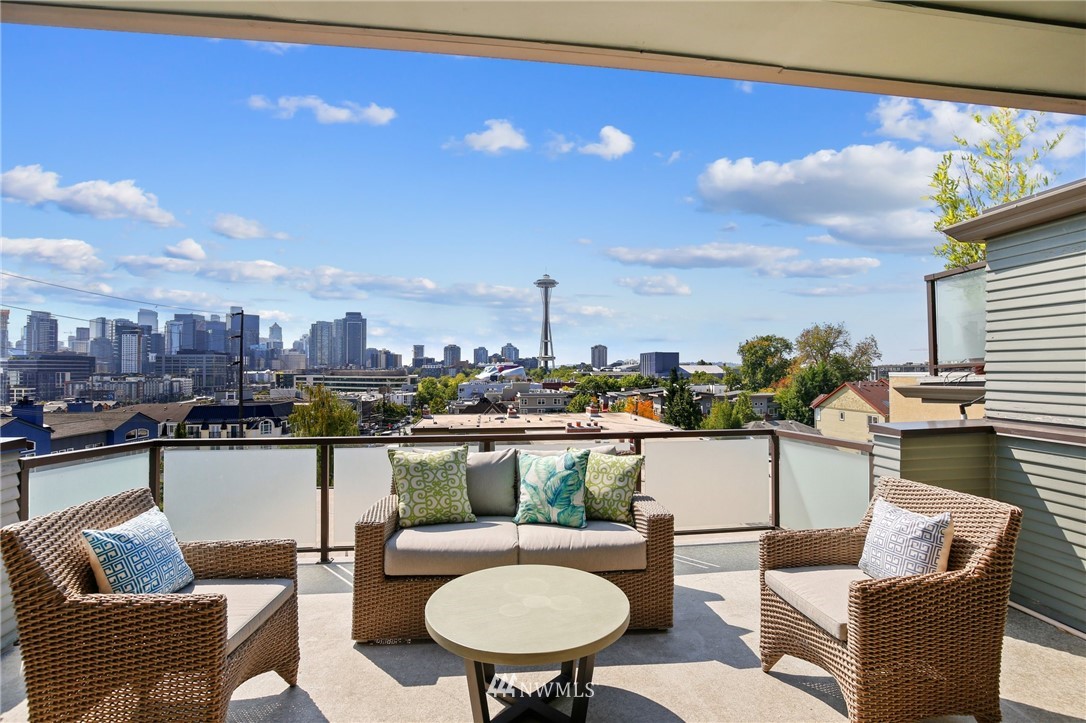 423 Ward Street Seattle, WA 98109 - Photo 2 of 39 a view of a chairs and table in patio