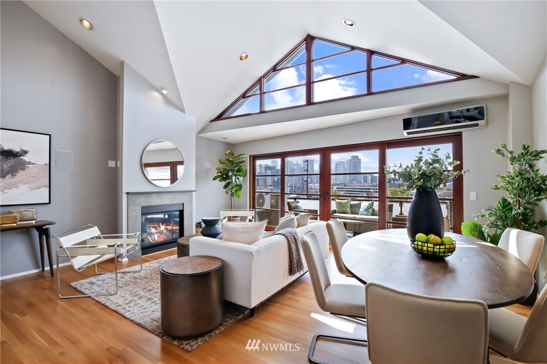 423 Ward Street Seattle, WA 98109 - Photo 17 of 39 a living room with fireplace furniture and a large window