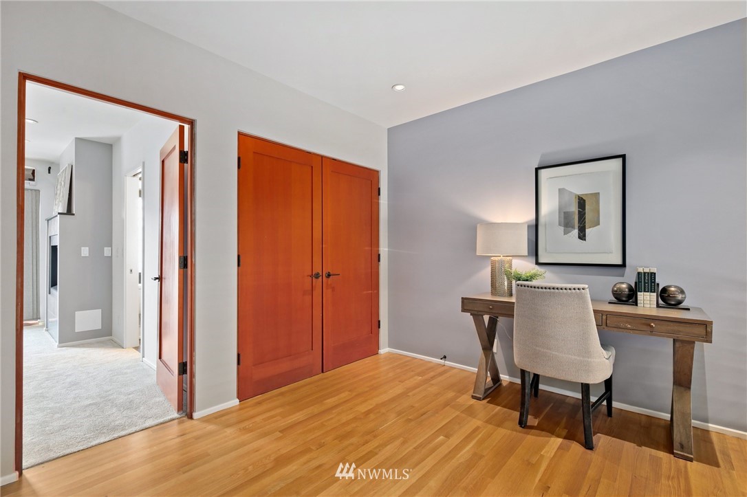 423 Ward Street Seattle, WA 98109 - Photo 20 of 39 a workspace with furniture and wooden floor