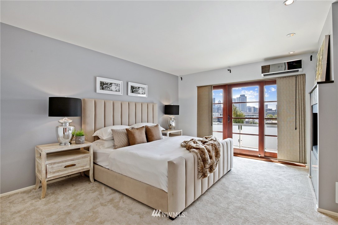 423 Ward Street Seattle, WA 98109 - Photo 21 of 39 a large bedroom with bed and large window