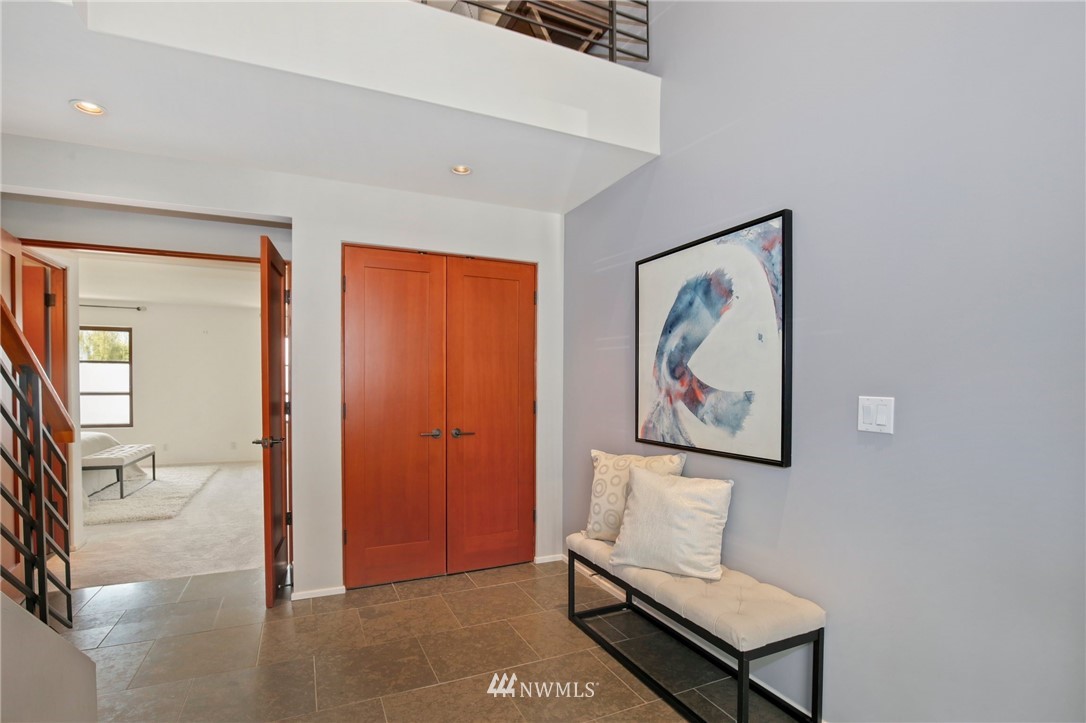 423 Ward Street Seattle, WA 98109 - Photo 30 of 39 a view of a hallway with paintings on the wall