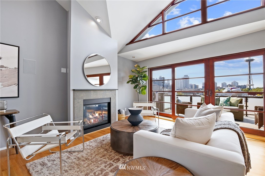 423 Ward Street Seattle, WA 98109 - Photo 4 of 39 a living room with furniture fireplace and a large window