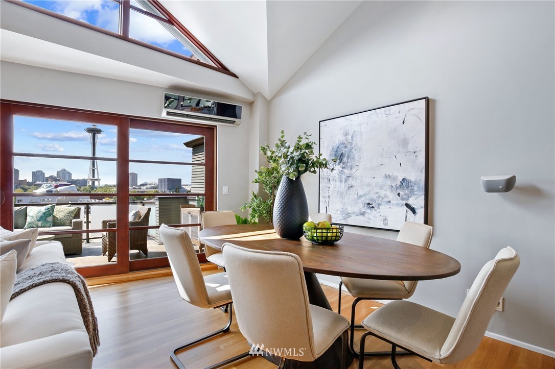 423 Ward Street Seattle, WA 98109 - Photo 6 of 39 a dining room with furniture and wooden floor