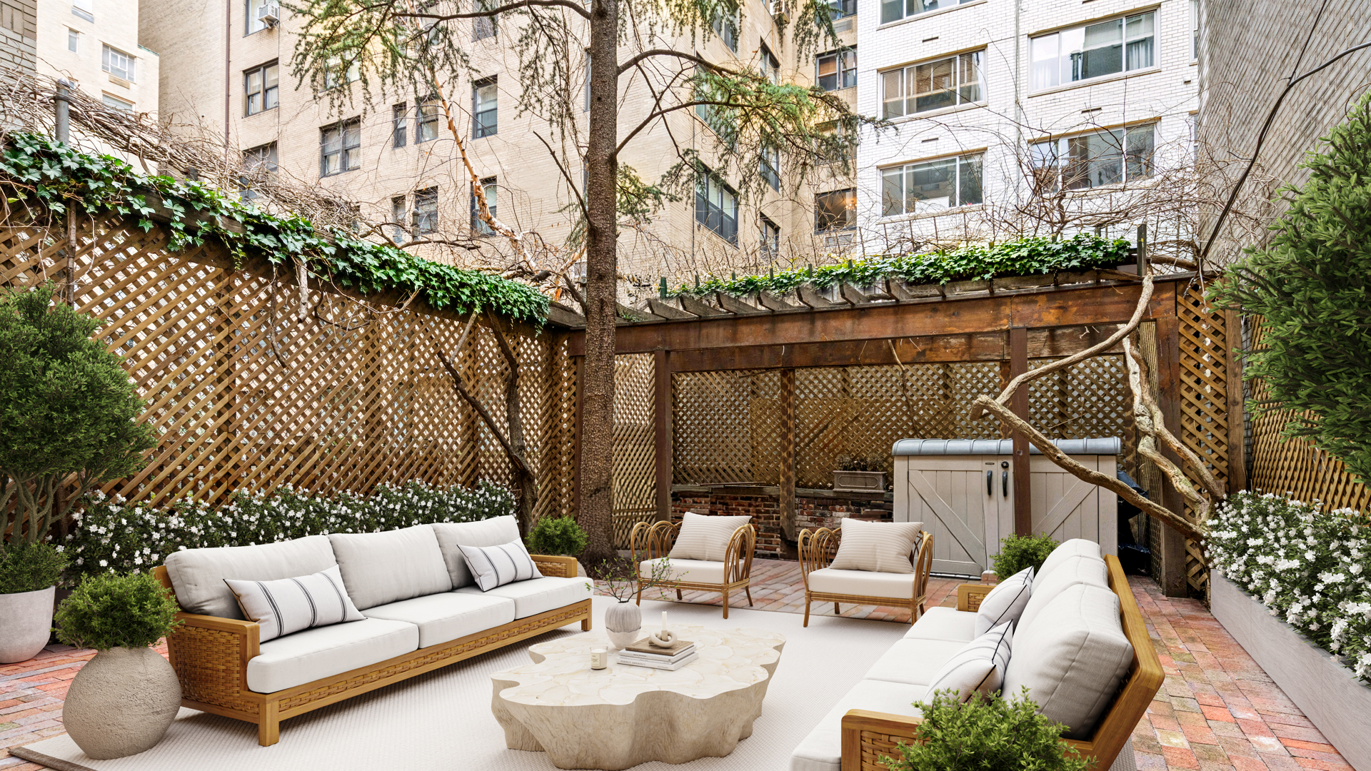 7 East 69th Street Manhattan, NY 10021 - Photo 22 of 27 a view of a patio with couches table and chairs and potted plants