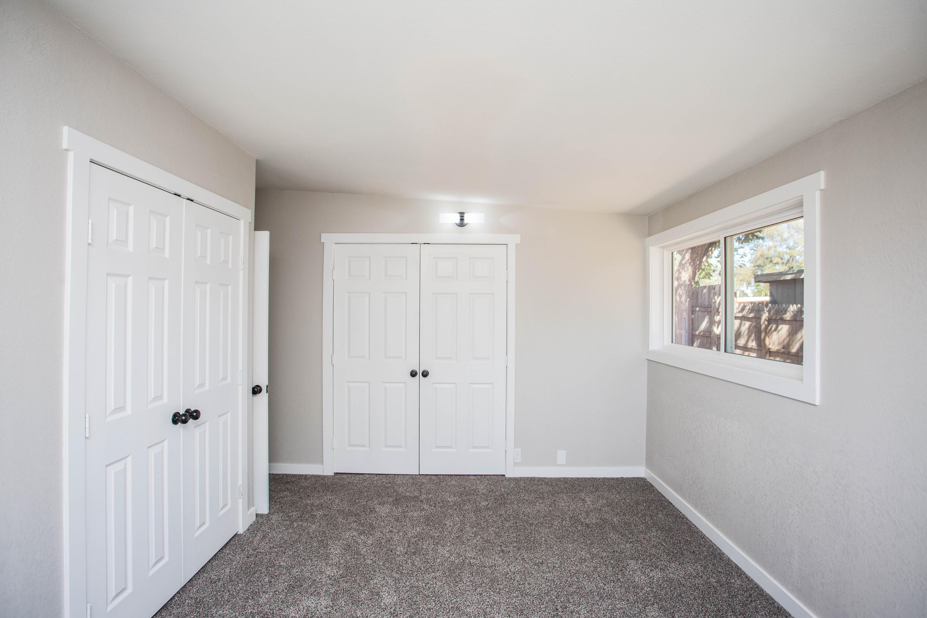 2725 63rd Street Lubbock, TX 79413 - Photo 18 of 41 a view of an empty room with closet and a window