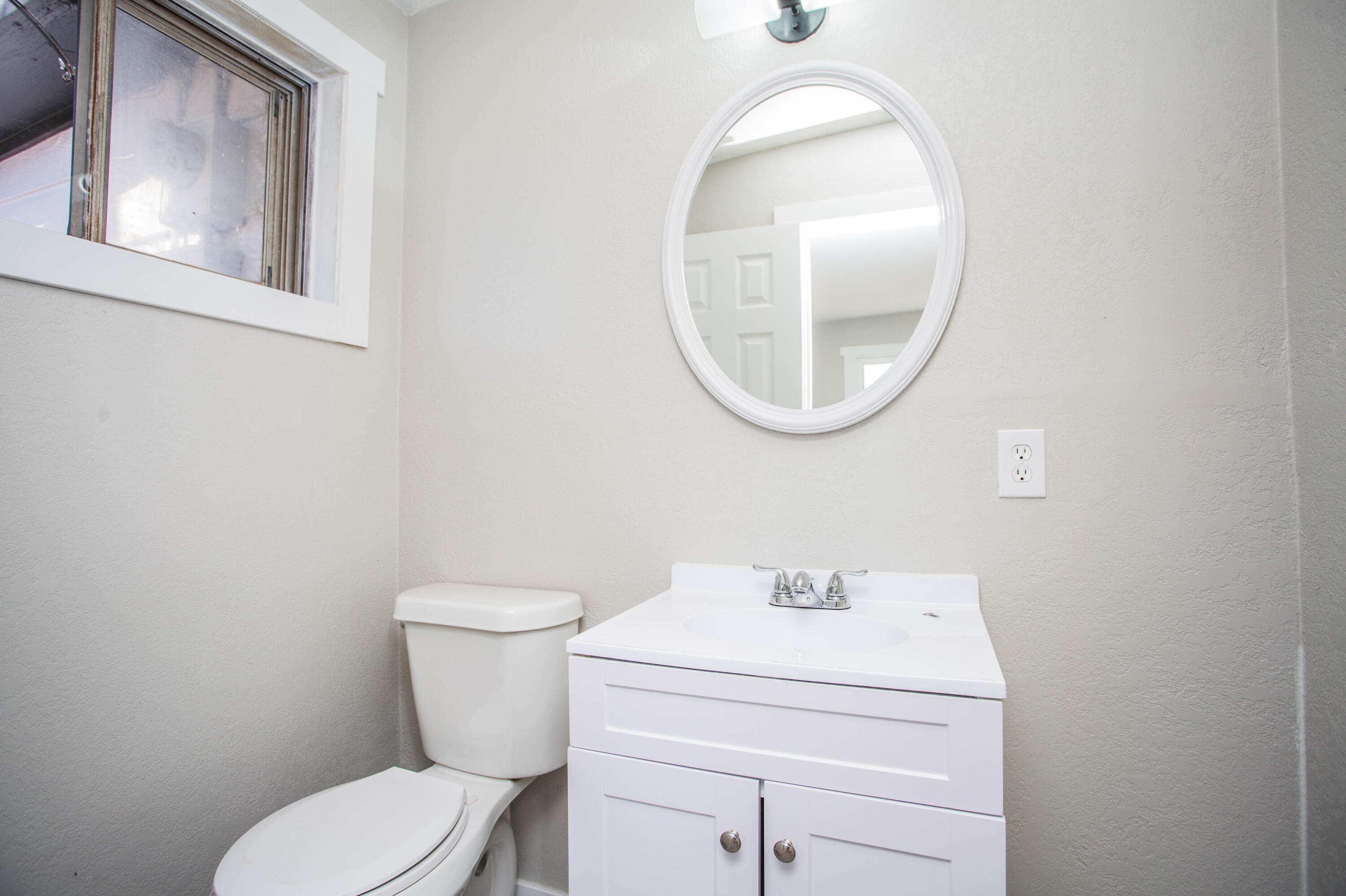 2725 63rd Street Lubbock, TX 79413 - Photo 21 of 41 a bathroom with a toilet and a sink