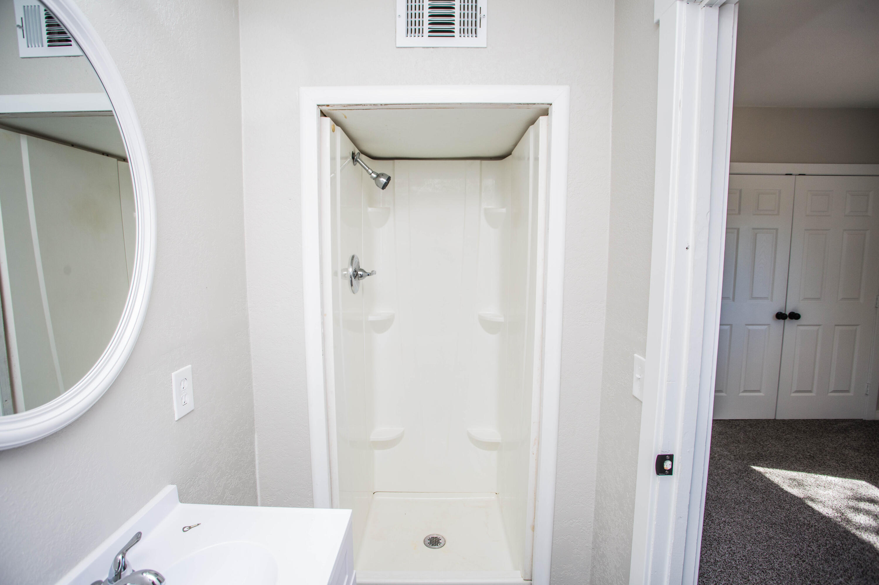 2725 63rd Street Lubbock, TX 79413 - Photo 24 of 41 a bathroom with a sink and a mirror