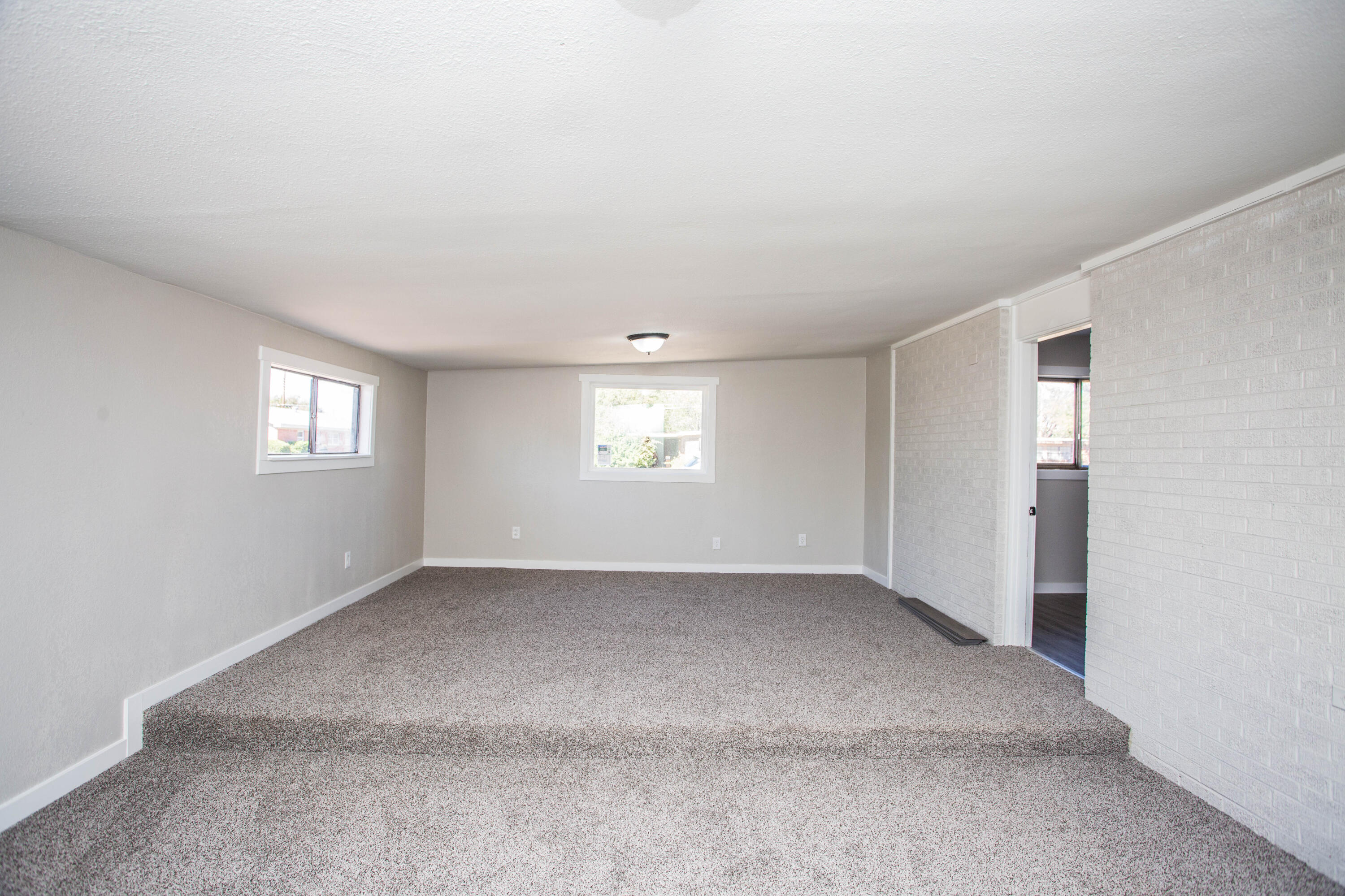2725 63rd Street Lubbock, TX 79413 - Photo 30 of 41 a view of an empty room with a window and closet area