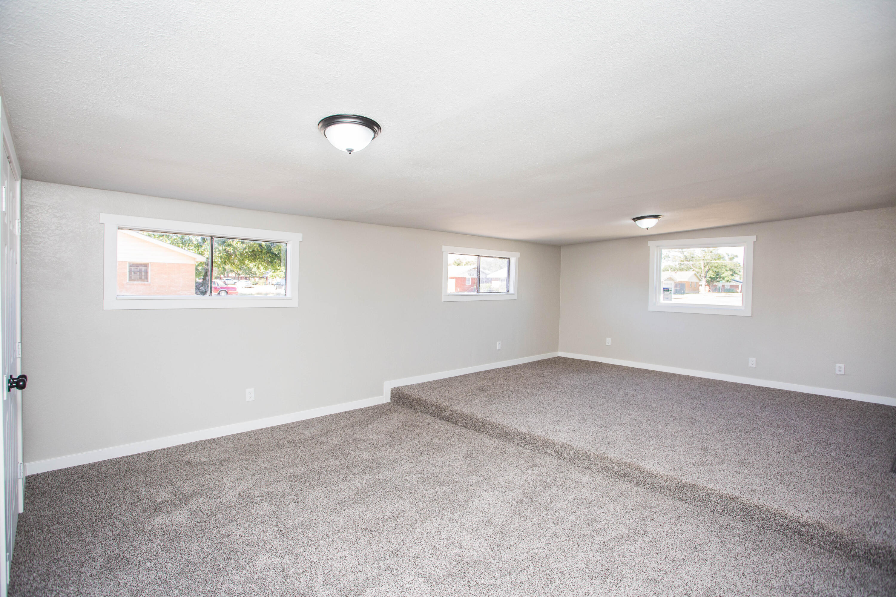 2725 63rd Street Lubbock, TX 79413 - Photo 31 of 41 an empty room with windows