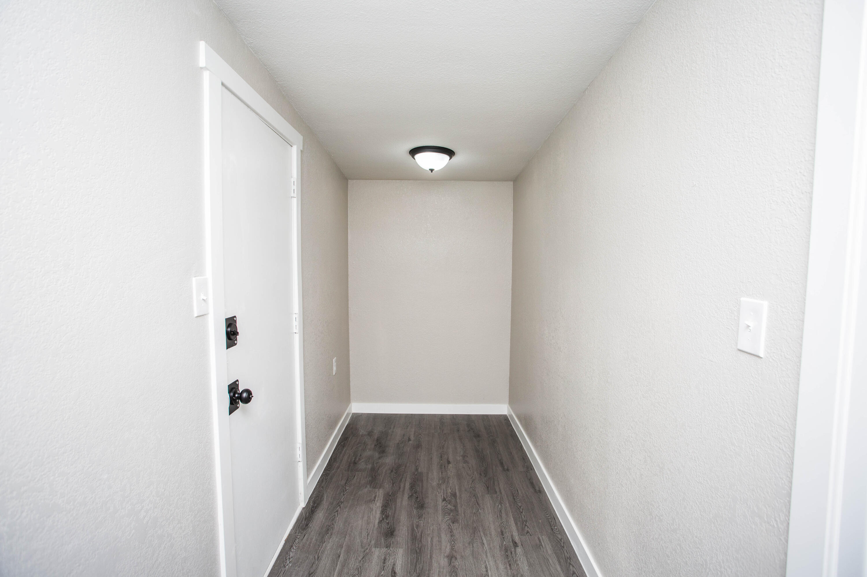 2725 63rd Street Lubbock, TX 79413 - Photo 32 of 41 a view of a hallway with wooden floor
