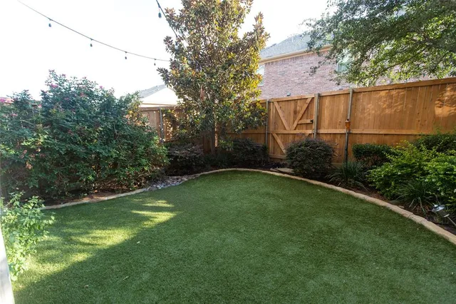 a backyard of a house with lots of green space