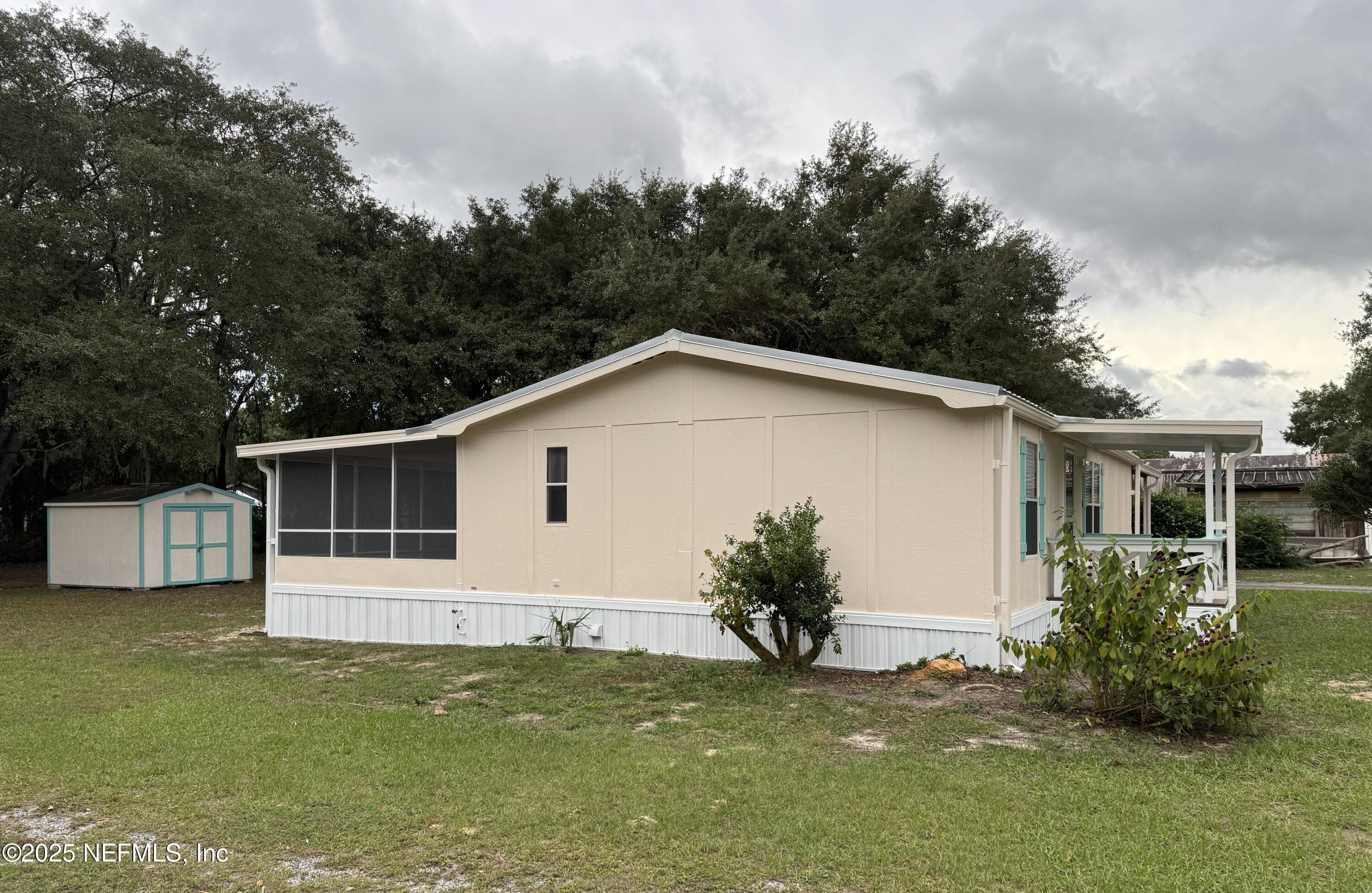 106 Ridgewood Avenue Interlachen, FL 32148 - Photo 15 of 23 a view of a house with a yard