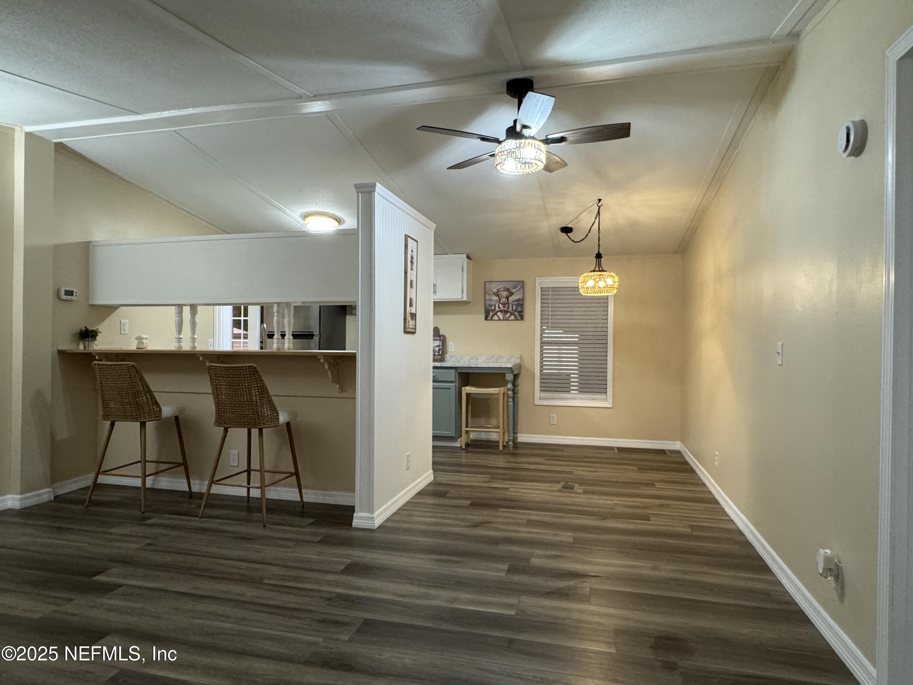 106 Ridgewood Avenue Interlachen, FL 32148 - Photo 19 of 23 a view of a livingroom with furniture wooden floor and a ceiling fan