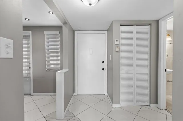 a view of a livingroom with an empty space and a window