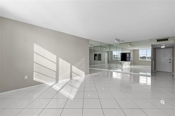 a view of an empty room with a window