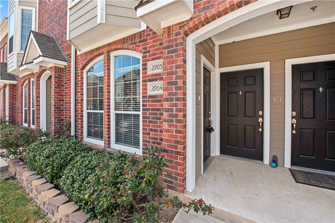 1198 Jones-Butler Road, Unit 1908 College Station, TX 77840 - Photo 2 of 16 Doorway to property featuring brick siding