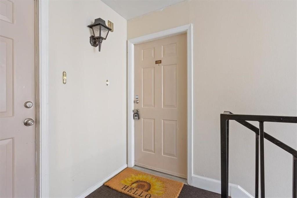 2306 Melissa Drive Waco, TX 76708 - Photo 4 of 22 a view of a hallway with wooden floor and closet