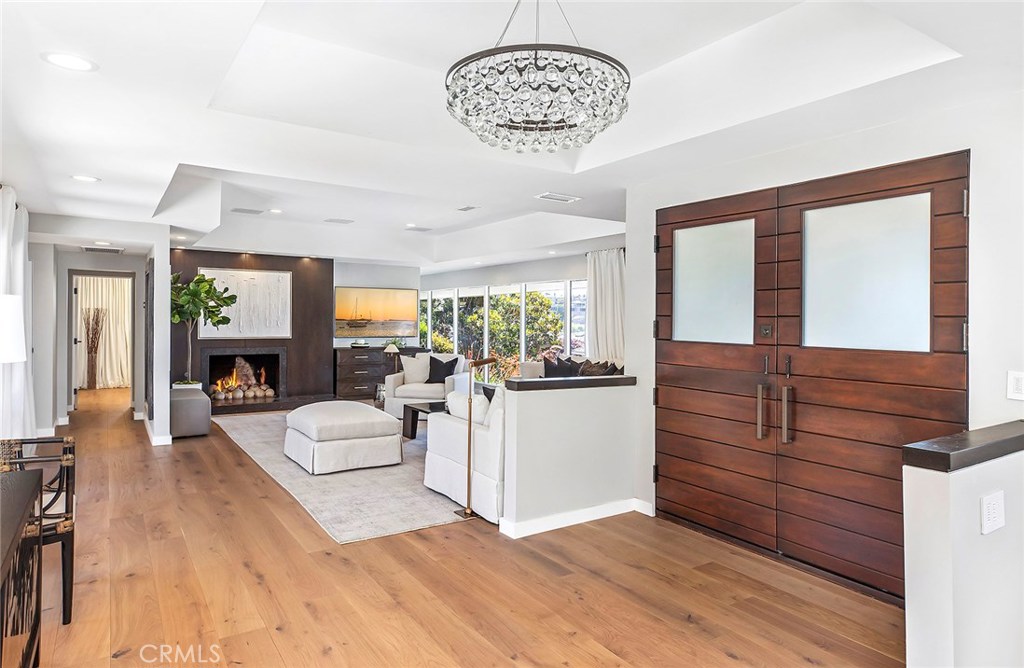 2526 Monaco Drive Laguna Beach, CA 92651 - Photo 17 of 59 a living room with furniture and a chandelier