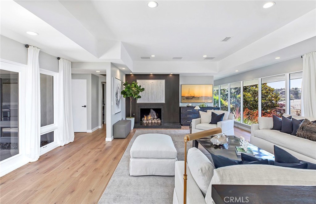 2526 Monaco Drive Laguna Beach, CA 92651 - Photo 19 of 59 a living room with furniture fireplace and a large window
