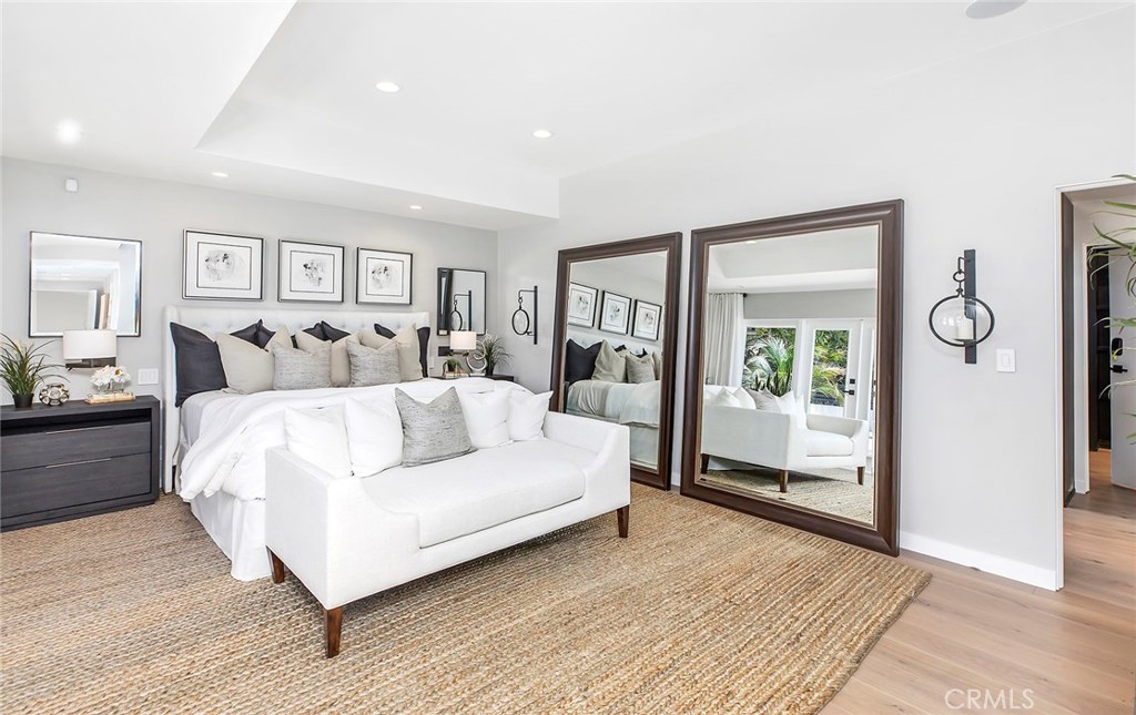 2526 Monaco Drive Laguna Beach, CA 92651 - Photo 22 of 59 a large bedroom with a bed and glass window