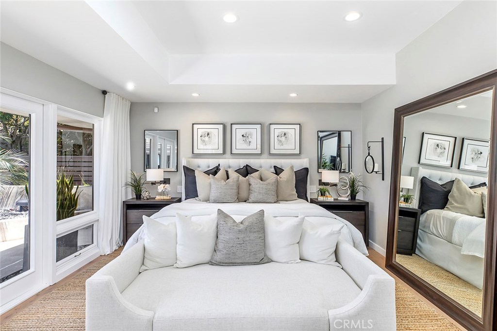 2526 Monaco Drive Laguna Beach, CA 92651 - Photo 23 of 59 a large white bedroom with a large bed and a couch